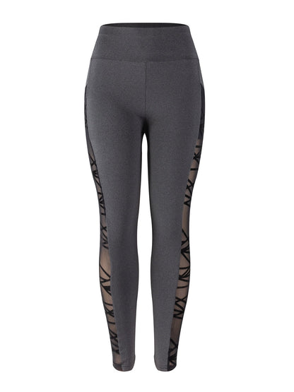 Gray leggings with sheer side panels on a white background