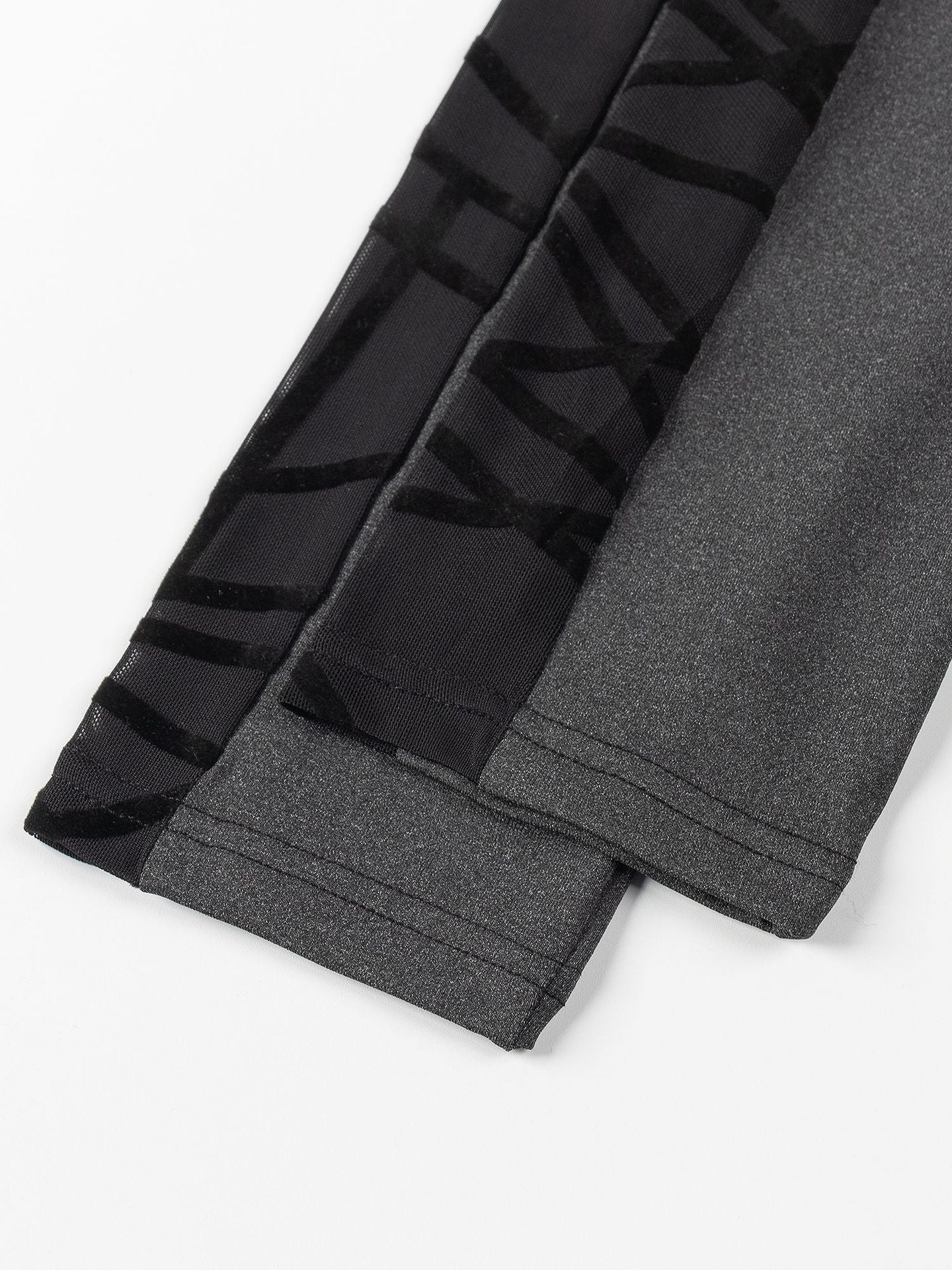 Gray leggings with black striped pattern on a white background