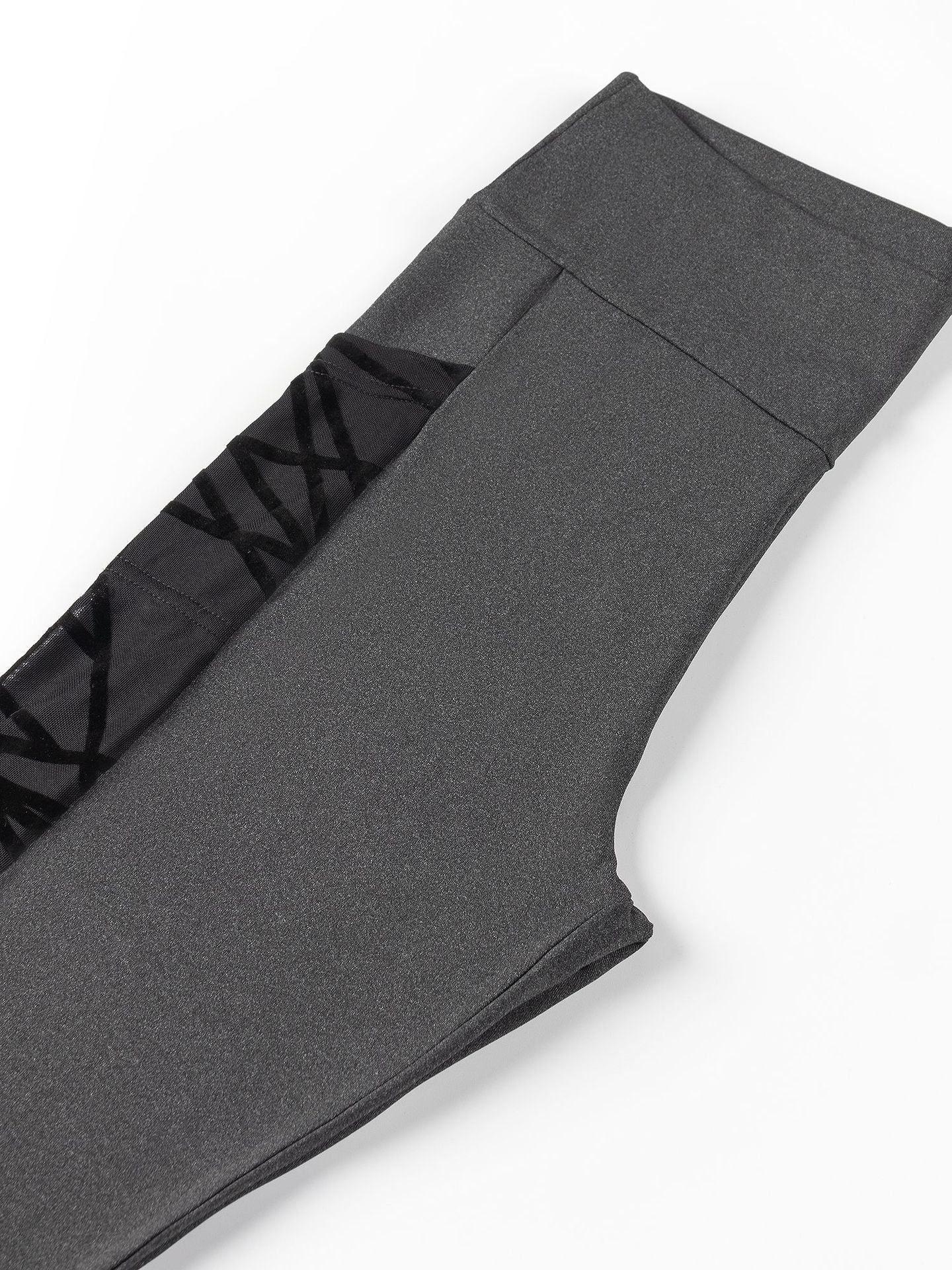 Gray leggings with black waistband on a white background