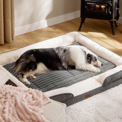 Dog lying on a large pet bed in a cozy room with a wood stove.