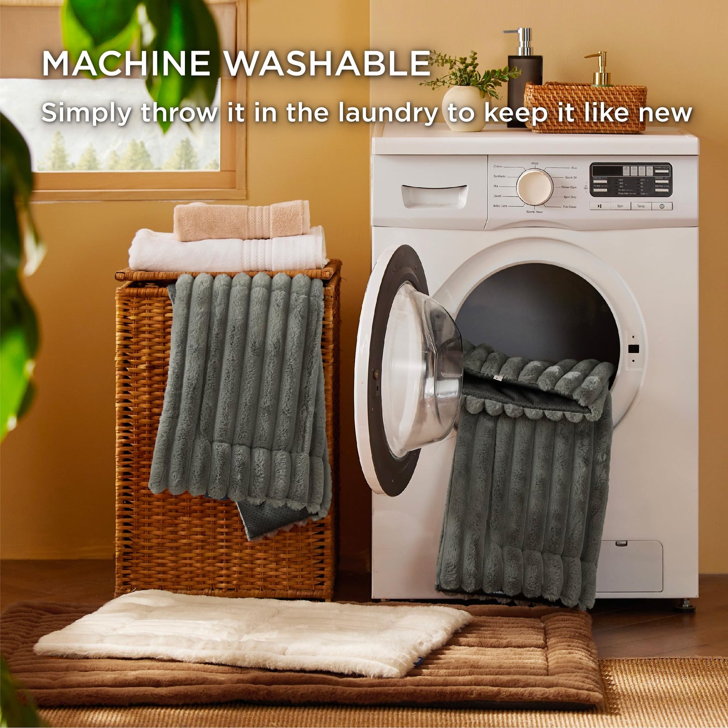 Laundry scene with a washing machine, basket, and towel, featuring text about machine washability.