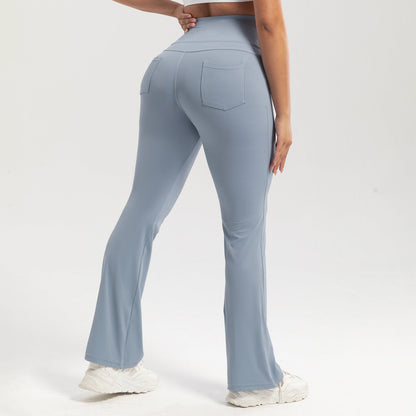 Light blue flared pants worn by a person on a white background