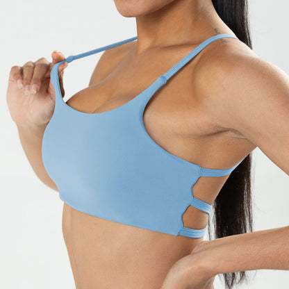 Light blue sports bra worn by a person on a plain background