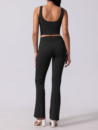 Person wearing a black athletic outfit on a white background