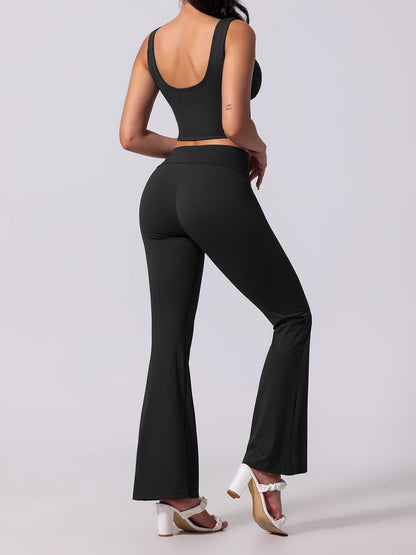 Person wearing a black athletic outfit on a white background