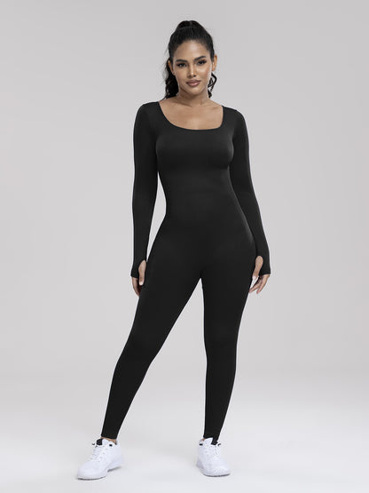 Person wearing a black bodysuit on a white background