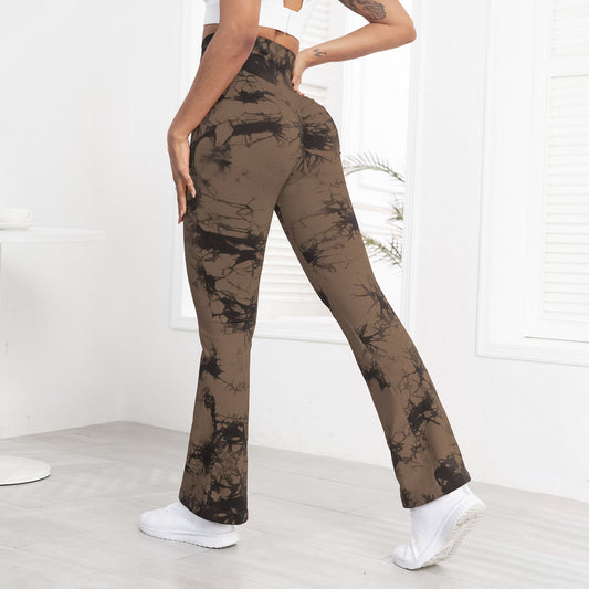 Person wearing brown tie-dye pants with a white background