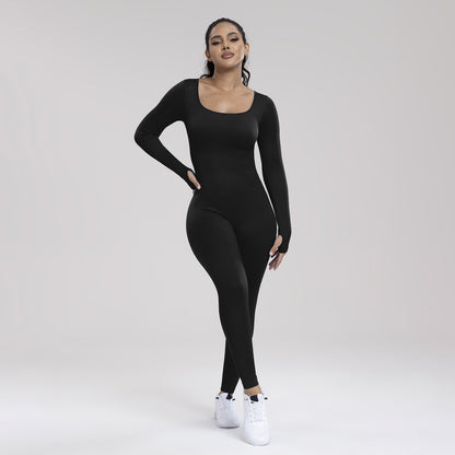 Woman wearing a black bodysuit on a white background